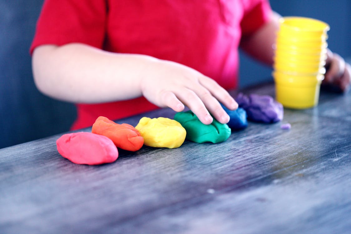 Free Person Making Clay Figures Stock Photo