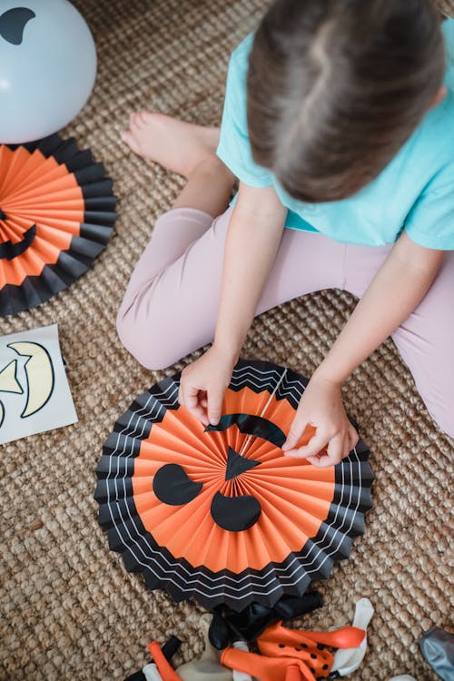 Free Close view on girl preparing Halloween decoration Stock Photo