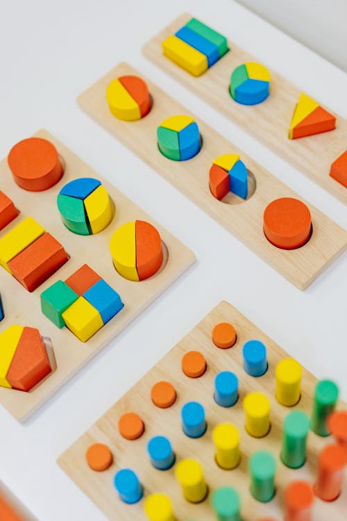 Free Close-up Shot of Colorful Shapes on the White Table Stock Photo