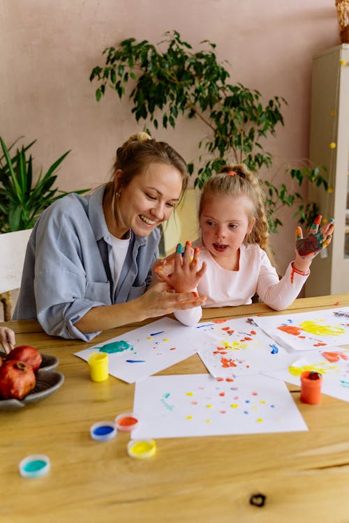 Free Mother and Daughter Painting Together Stock Photo