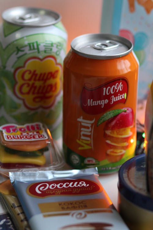 Free A variety of international snacks and drinks including Chupa Chups and Vinut mango juice. Stock Photo