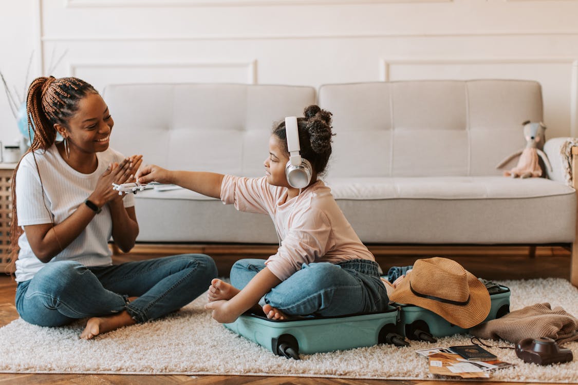 Free woman and Child Playing at Home Stock Photo