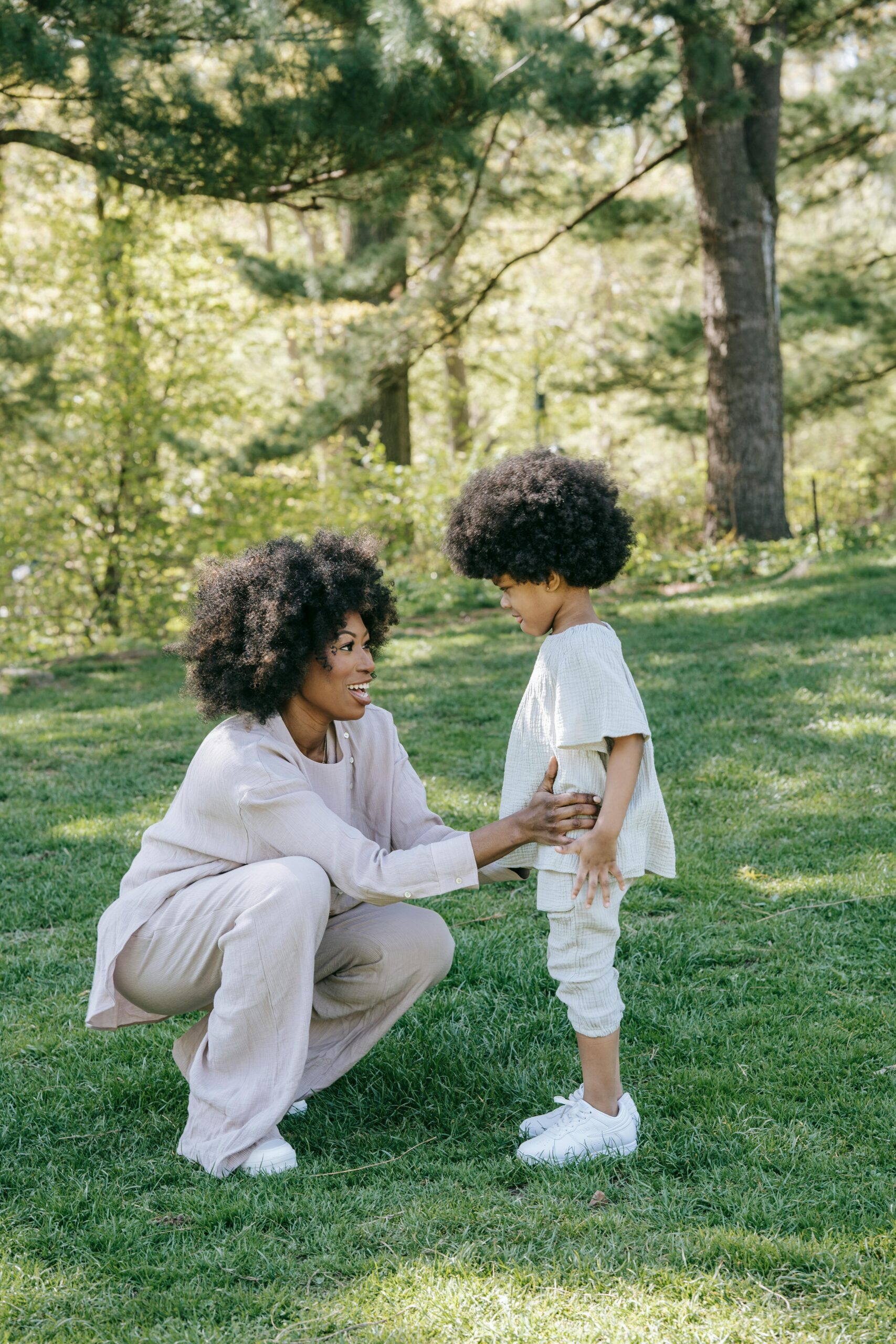 Free A Woman Talking to her Child at a Park Stock Photo