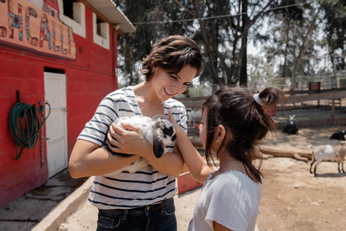 Free Two Women Holding a Bunny Stock Photo